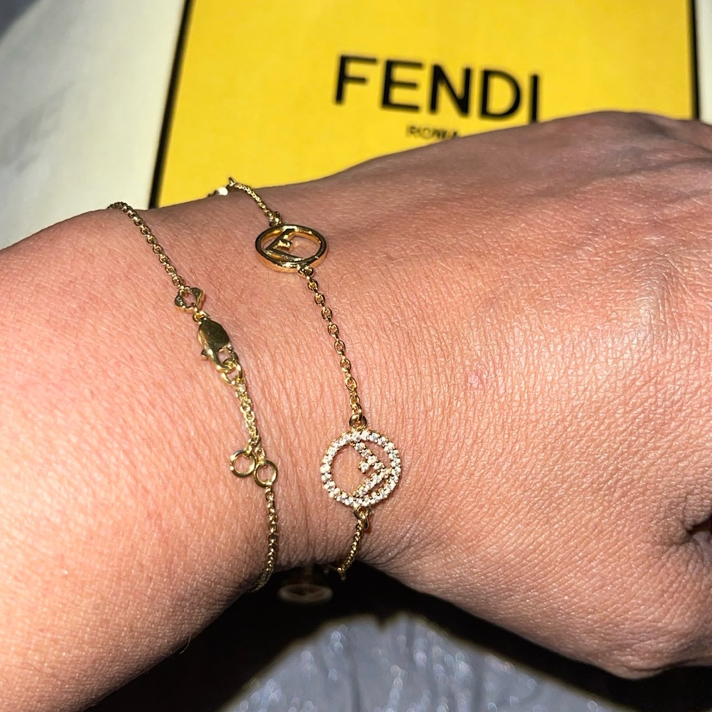 Preloved Fendi bracelet excellent condition gold color very shiny.